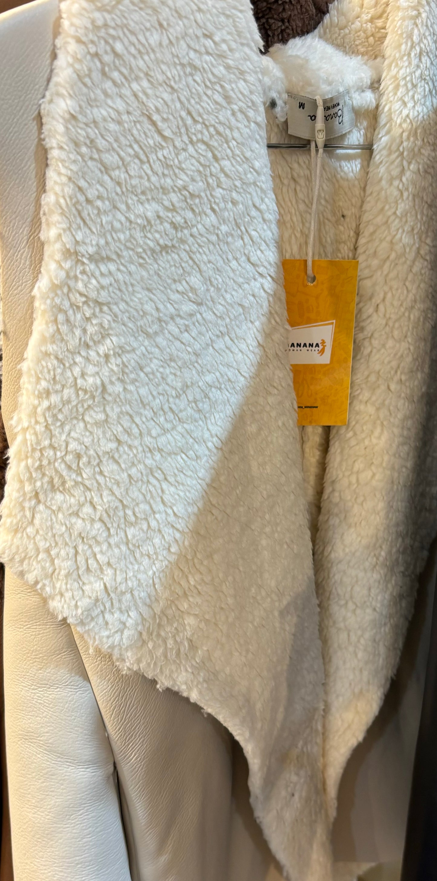 The off-white fur sleevless